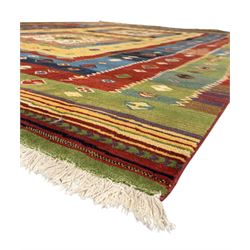 Late 20th century Louis De Poortere Belgian Shalamar wool ground rug, featuring a vibrant multi-coloured geometric design with stacked rectangular borders surrounding two central medallions, finished with fringed ends