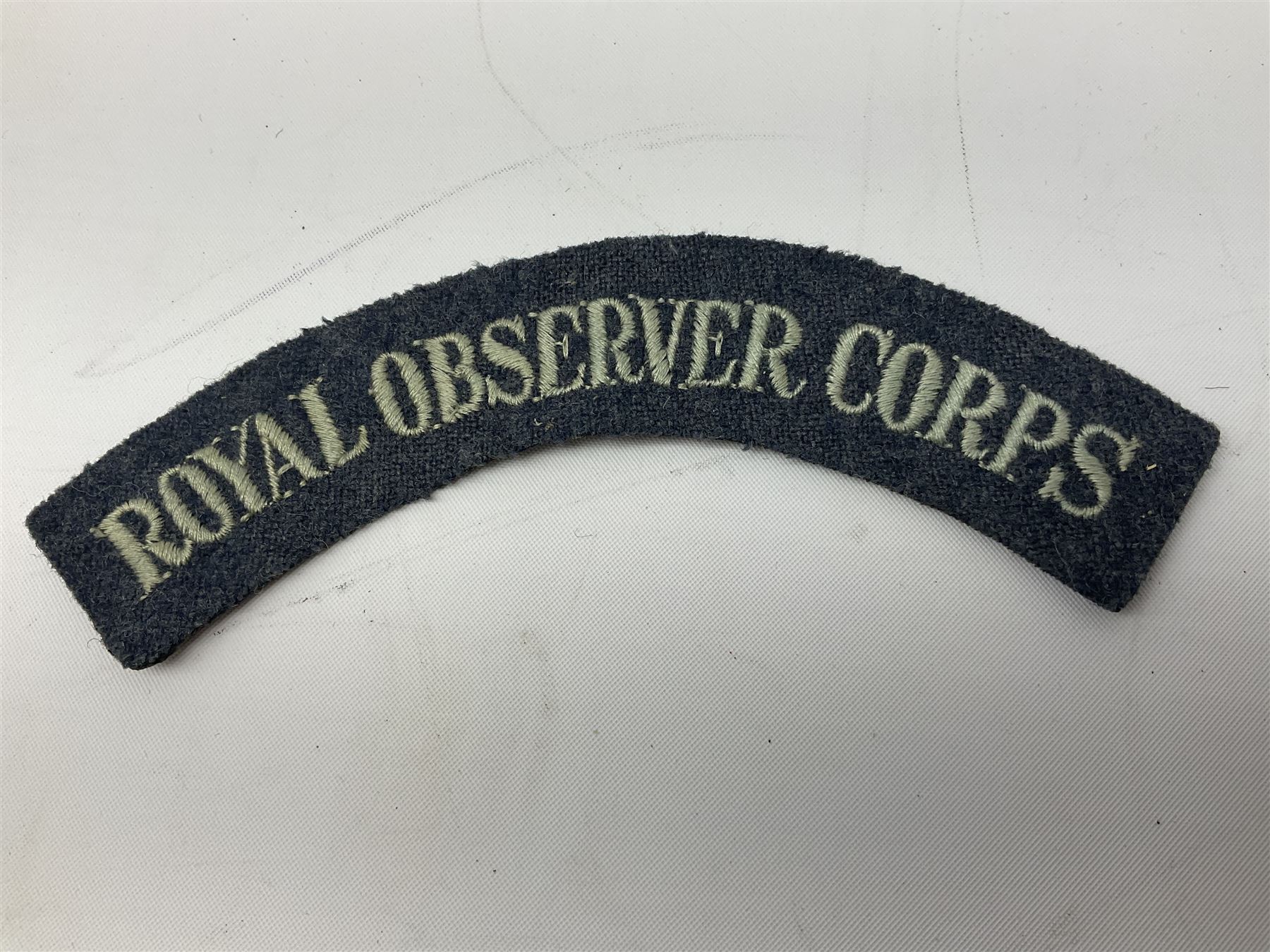 WW2 Royal Observer Corps - approximately one-hundred and seventy aircraft recognition cards; 1938 Instruction Booklet; cap badge and lapel badge; and cloth shoulder title