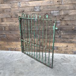 19th century French cast iron garden gate, finished in green rustic paint, bar form with hoop and spear top, with loop hinge brackets