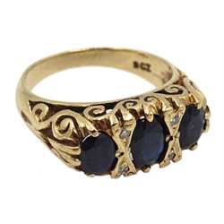 Gold three stone oval sapphire and diamond chip ring, stamped 9ct