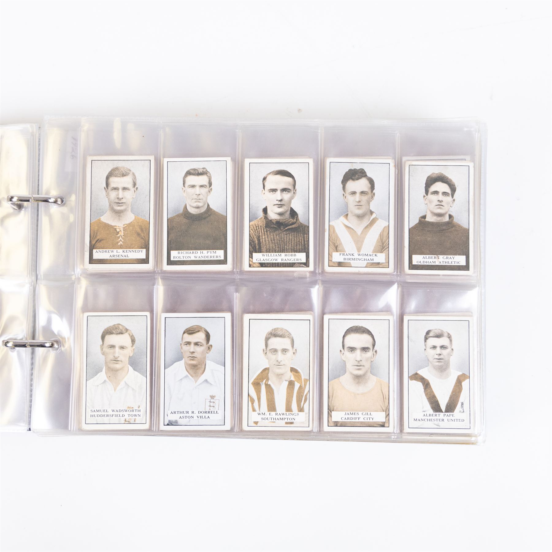 Collection of Edwardian and later Football related trading and cigarette cards, including forty-nine of fifty 1906 Ogden's Football Club Colours, 1922 PALS Footall series, ninety of one hundred 1925 Gallaher Famous Footballers, complete set of forty-four 1926 Ogden's Captains of Association Football Clubs and Colours, complete set of fifty 1927 Players Football Caricatures by MAC,  complete set of fifty 1927 Players Football Caricatures by RIP,  complete set of fifty 1930 Players Association Cup Winners, complete set of 50 1933 Ogdens AFC Nicknames etc, housed in brown cigarette card album