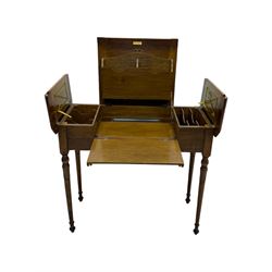 Edwardian oak metamorphic 'Britisher Writing Table', rectangular hinged top revealing correspondence compartments and hinged writing surface with underside storage, flanked by twin hinged compartments with dividers, on turned supports
