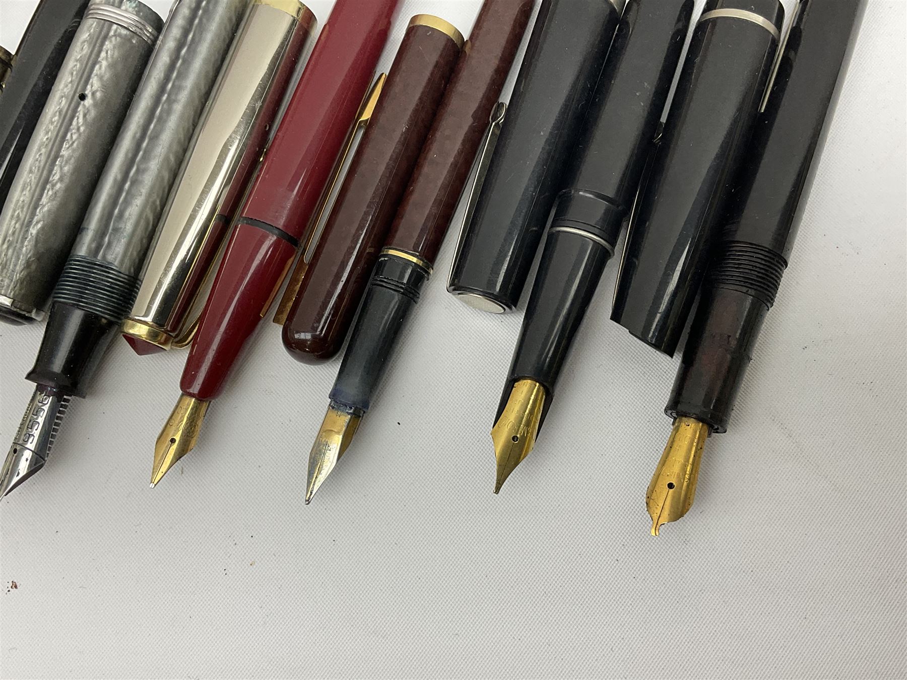 Six fountain pens with gold nibs to include Sheaffer, Macniven & Cameron Ltd and Conway examples, together with four other fountain pens including a boxed Parker pen and a boxed Sheaffer pen in black case with chevron pattern detail