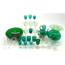 A quantity of various green glassware, to include a large bowl, large glass on knopped stem, and various drinking glasses, together with a quantity of assorted drinking glasses with acid etched key fret pattern detail. 