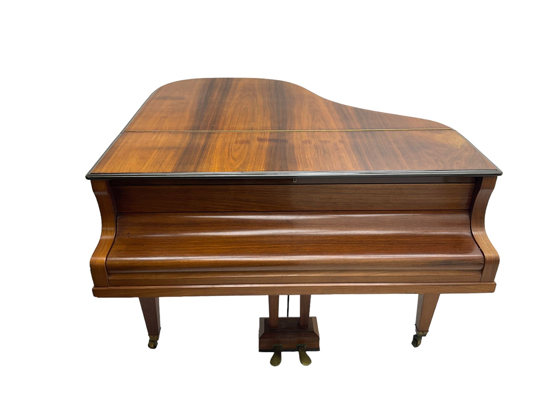  Antonin Petrof - Walnut overstrung baby grand piano, 7 0catve 85 key compass with original strings, tuning pins, damper felts and hammer heads, with roller keyboard action and iron frame, sustaining and una-corda pedals, sliding open lattice music desk, supported on square tapering legs with brass cups and castors, with inner ebonised key fall and ivorine label inscribed 'Supplied by Harrods, London'.