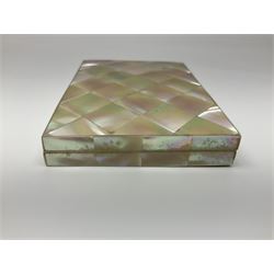 Victorian mother of pearl tea caddy, of rectangular bow-fronted form, the body with floral, bird and geometric engraved mother of pearl panels, white metal shield plaque to the cover inscribed with the initials G.J.A and similar escutcheon, the two division interior with ivory edging and two panelled mother of pearl lids, on four vegetable ivory bun feet L20cm, together with a similar style mother of pearl card case (2) This item has been registered for sale under Section 10 of the APHA Ivory Act