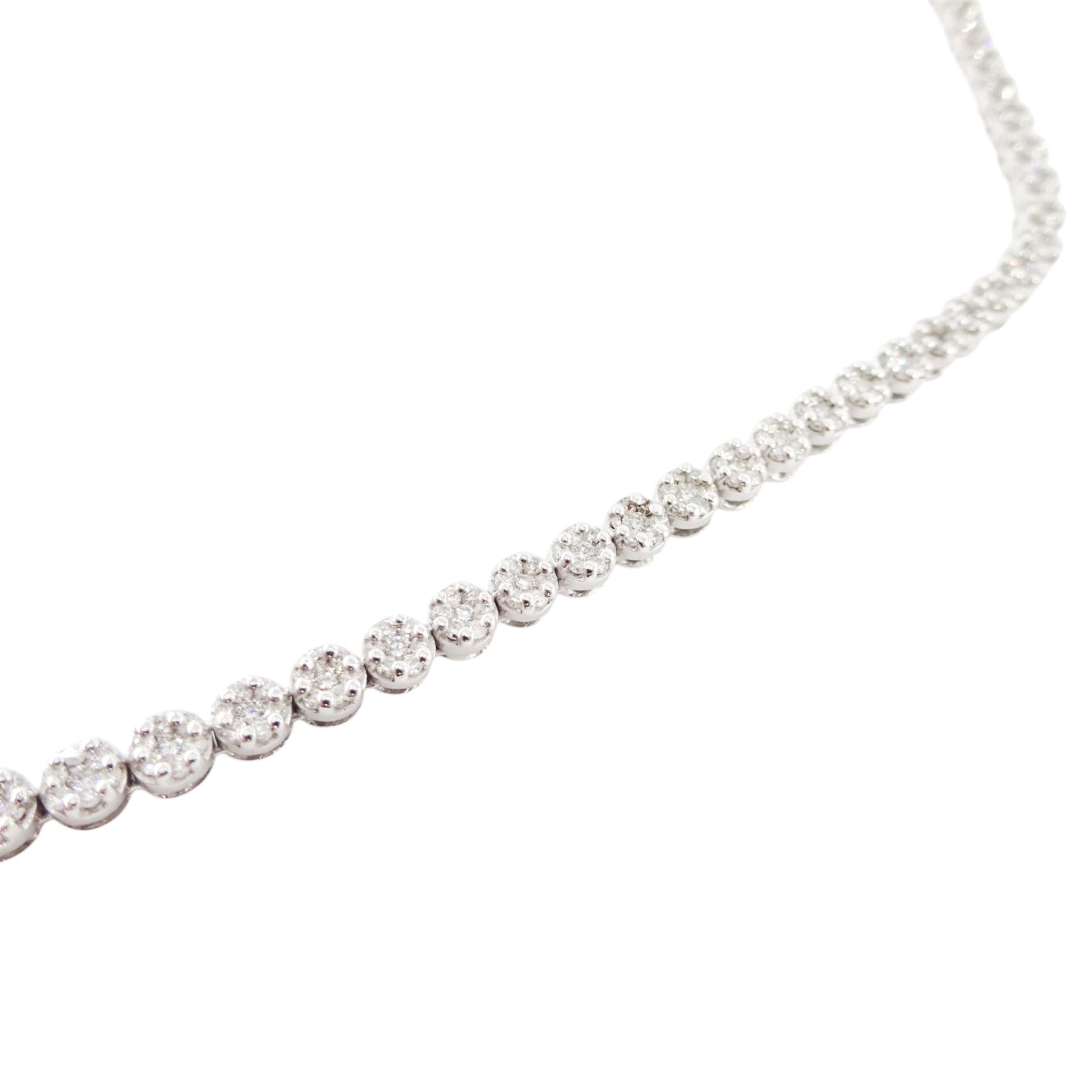 18ct gold diamond necklace, one hundred fourteen clusters, each set with seven round brilliant cut diamonds, hallmarked, total diamond weight 5.00 carat, boxed with certificate