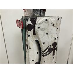 Folk art circus clown cabinet, the the two hinged doors with bow tie decoration opening to reveal fitted shelved interior, the body painted with polka dots and spades, H121cm