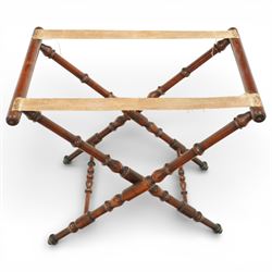 19th century coaching table, the rectangular tray top with shaped gallery and cut out carrying handles, raised on a folding X frame stand with turned supports and stretcher rails