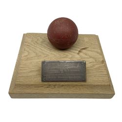 Raich Carter - early school cricket trophy of a cricket ball mounted on an oak base with white metal plaque inscribed 'Swan Cup Final/July 1927/Hendon v Jas.Wms.St/Scores/Hendon 189 for 2 wickets/Jas.Wms.St 55/Carter 111 runs (not out) Four wickets for 21 runs/Hendon School Souvenir/from his Head master G.F. Park' L20cm. Provenance: By direct descent from the family of Raich Carter having been consigned by his daughter Jane Carter.