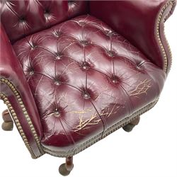 Hancock & Moore - swivel office desk chair, upholstered in buttoned burgundy leather with studded bands, five-spoke base on castors