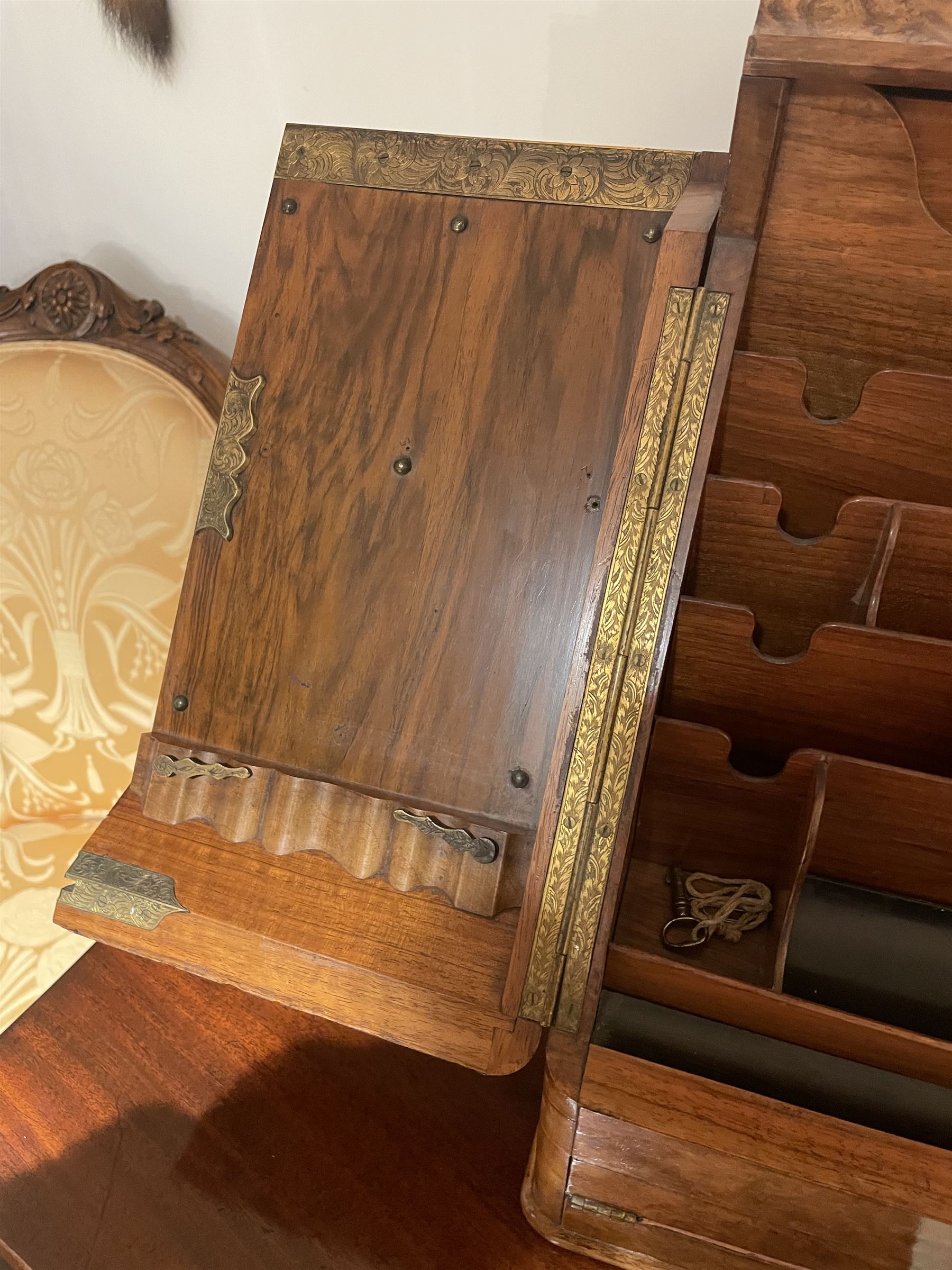 19th century burr walnut correspondence box, the sloped front opening to reveal a fitted interior with perpetual calendar, letter racks, and pen tray between two inkwell recesses, above a pull out draw with recessed brass handle, H41cm L40.5cm D28.5cm