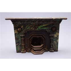  Victorian doll's house or traveller's sample cast-iron fire surround with painted marble finish and removable fire-back, marked Rowbotham L15cm  