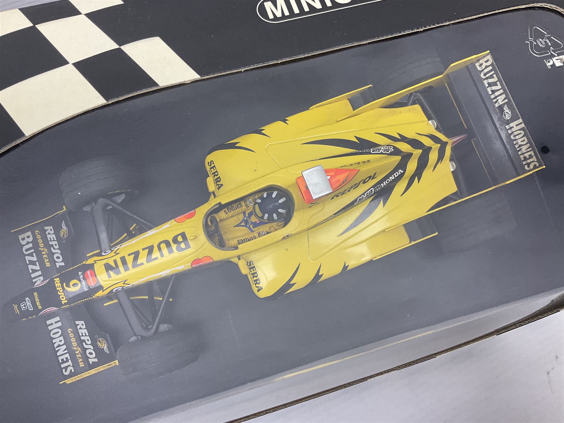 Three Minichamps 1:18 scale die-cast racing cars - Jordan Mugen Honda 198 D. Hill; Jordan Ford EJ13 G. Fisichella; and Stewart Ford SF 1 R. Barrichello; all boxed (3)