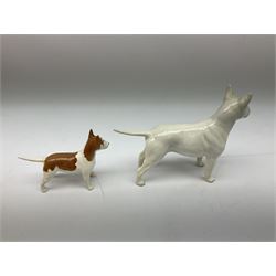 Two Beswick figures, white bull terrier, model 970 and brown and white bull terrier, model 1753, together with five other dog figures  