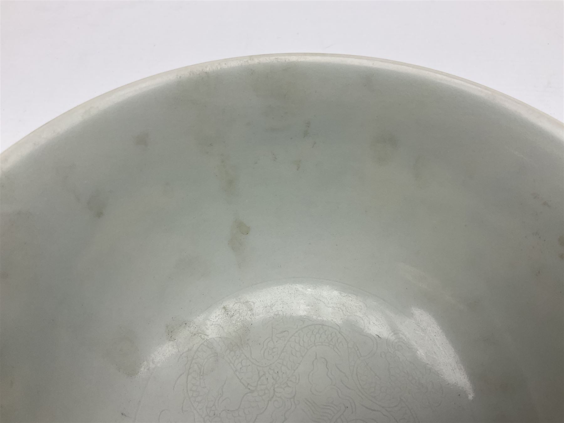 Pair of Chinese famille jaune bowls, decorated in green enamel with a dragon chasing a flaming pearl amongst clouds, upon a yellow ground, the interior decorated to centre with dragon, with six character mark beneath, D17.5cm