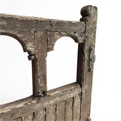 Pair of 19th century weathered wooden ecclesiastical church gates, the cresting rail over four pierced arches with slatted lower section, fitted with heavy cast iron hinges, latch and fittings