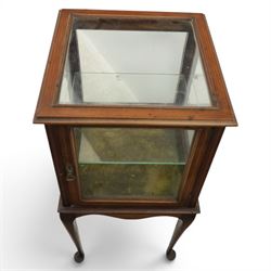Edwardian bijouterie two tier table, glazed top and sides with inlay surround, glazed door enclosing a single shelf and baized lined interior, raised on cabriole supports