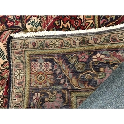  Persian style red ground rug, central medallion (243cm x 171cm)  and a similar red and blue ground rug (294cm x 206cm) (2)  