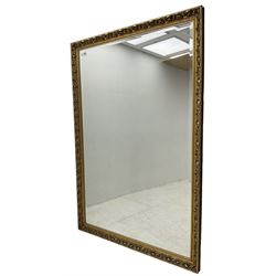 Large rectangular wall mirror, bevelled mirror plate in moulded gilt frame decorated with scrolling foliate 