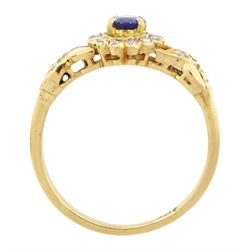 18ct gold sapphire and diamond cluster ring, single oval cut sapphire of approx 0.50 carat, surrounded by fourteen round brilliant cut diamonds, with pierced crossover diamond set shoulders, stamped, total diamond weight approx 0.20 carat
