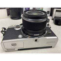 Olympus PEN-F camera body, with 'Olympus M- Zuiko Digital 25mm 1: 1.8' lens,  'Olympus M- Zuiko Digital 75-300mm 1: 4.8 - 6.7' lens and  'Olympus M- Zuiko Digital 17mm 1: 1.8' lens, with original box, together with Lowepro camera bag