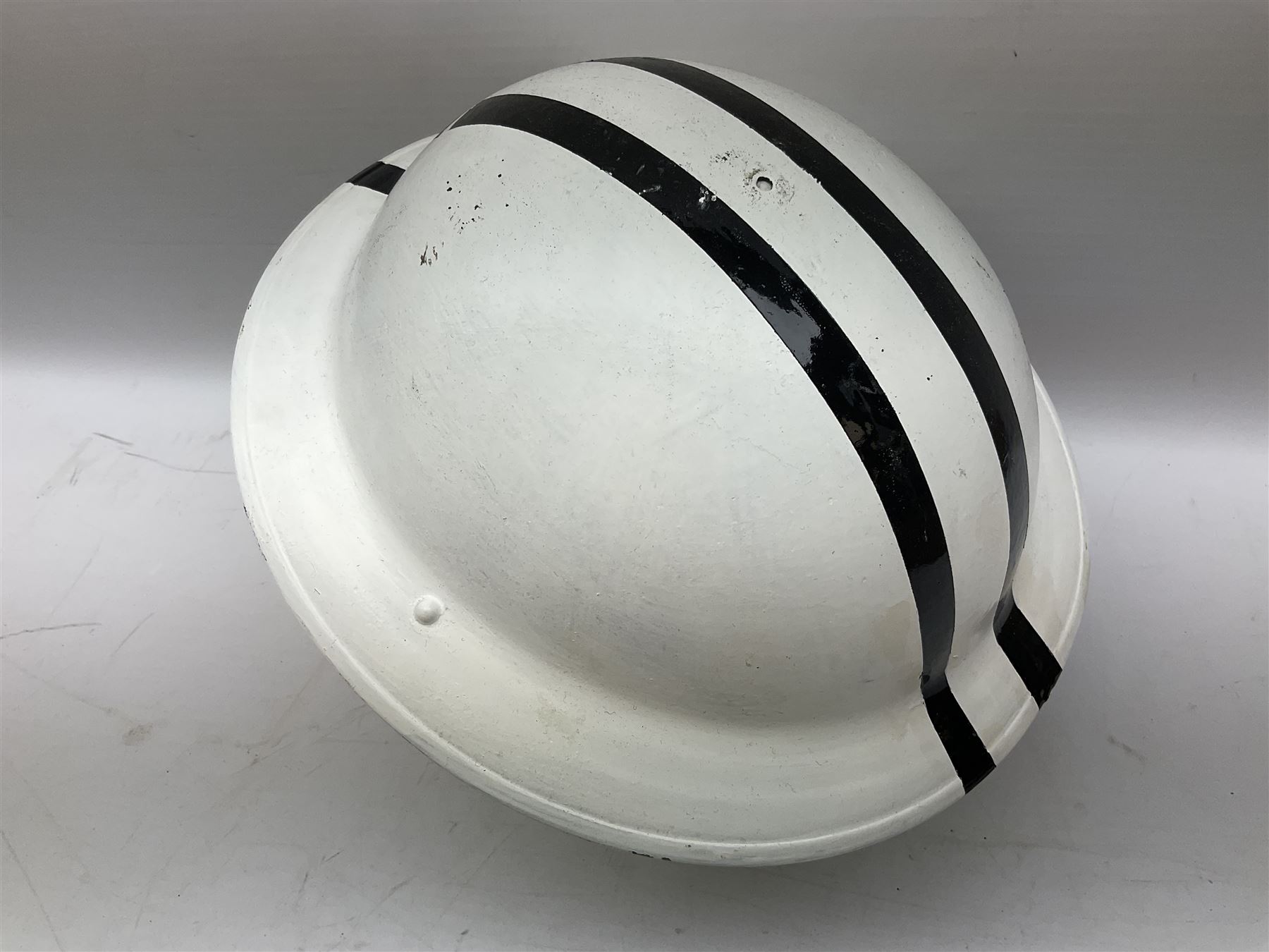 WW2 Home Front 'Police' black painted steel helmet with original liner and webbing chin strap, impressed R.O. Co. 1/1939; and re-painted shell only for WW2 Wardens steel helmet impressed AMC II 1941 C676 (2)