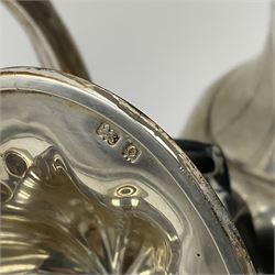 Five piece Edwardian silver tea service, comprising teapot and coffee pot, each with ebonised scroll handle, tea caddy with hinged cover, twin handled open sucrier, and milk jug, each of rounded bombe form, upon four paw feet, hallmarked William Adams Ltd, Birmingham 1904 and 1905, coffee pot H26cm

