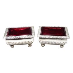 Pair George III silver rectangular baluster salts with cast acanthus folded rims and original cranberry glass liners by Thomas Radcliffe, London 1805, approx. 7oz