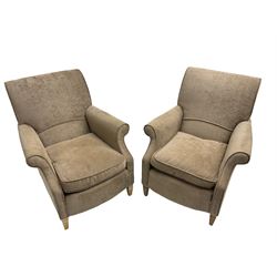 Pair of traditional shaped armchairs, scrolled back and arms, upholstered in beige fabric, raised on tapered beech supports