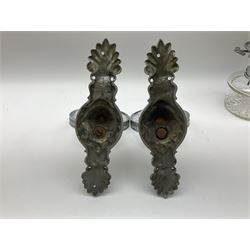Pair of chrome mounted glass oil lamps, each mount in the form of a lion mask with a ring bracket 