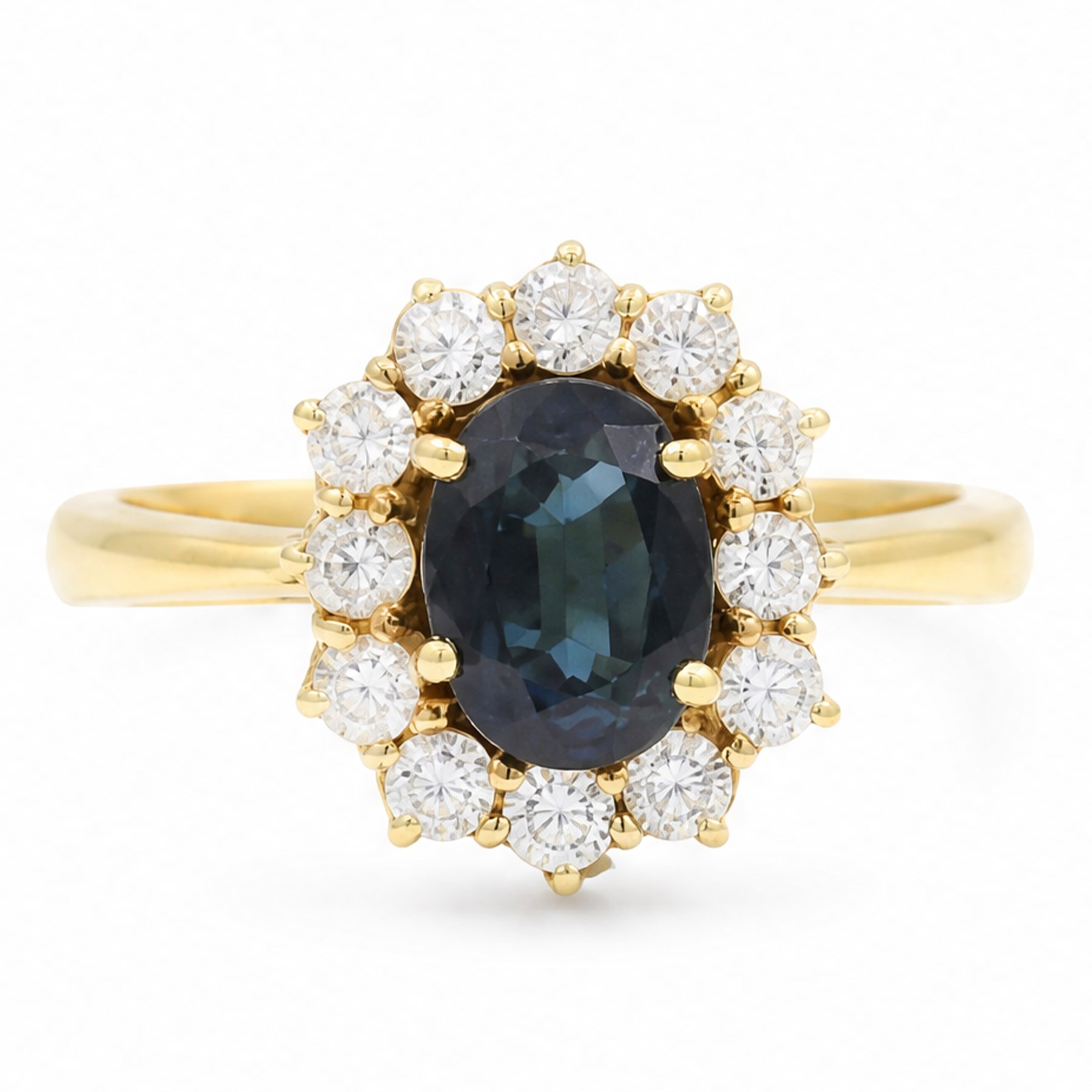 18ct gold sapphire and diamond cluster ring, single oval cut sapphire of approx 1.05 carat, surrounded by twelve round brilliant cut diamonds, stamped 750, total diamond weight approx 0.25 carat