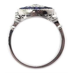  Platinum diamond and sapphire target ring, the central diamond approx 0.5 carat, diamond shoulders  