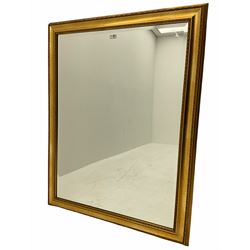 Rectangular bevelled edge wall mirror, in gilt frame