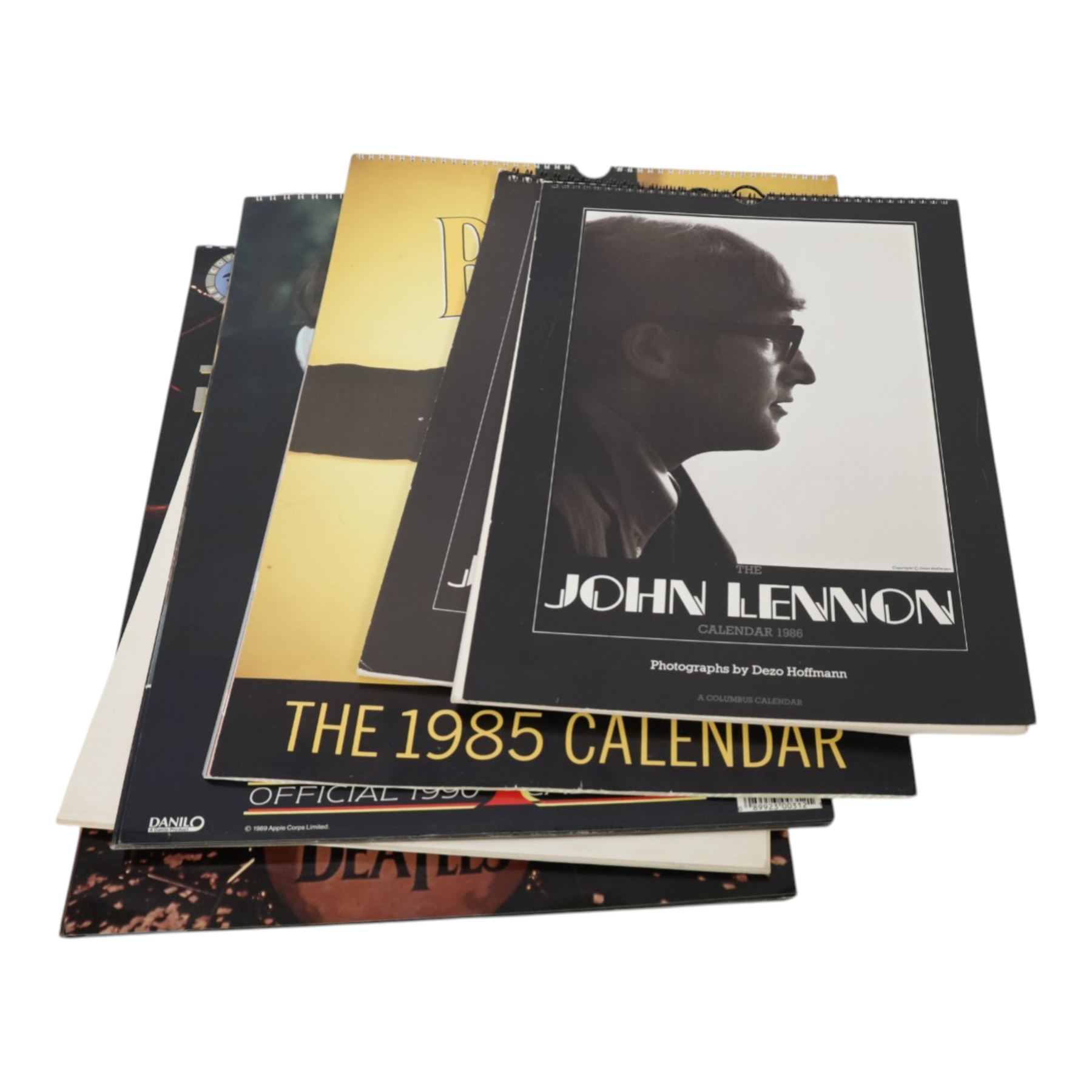 Beatles memorabilia, comprising four Linda McCartney photograph diaries from 1976-1979, three posters, four coasters, 1970 John & Yoko calendar, 1980s and 1990s Beatles and John Lennon calendars
