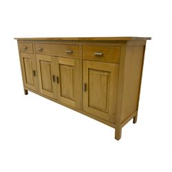 G-Plan - light oak sideboard, fitted with three drawers and four panelled cupboards