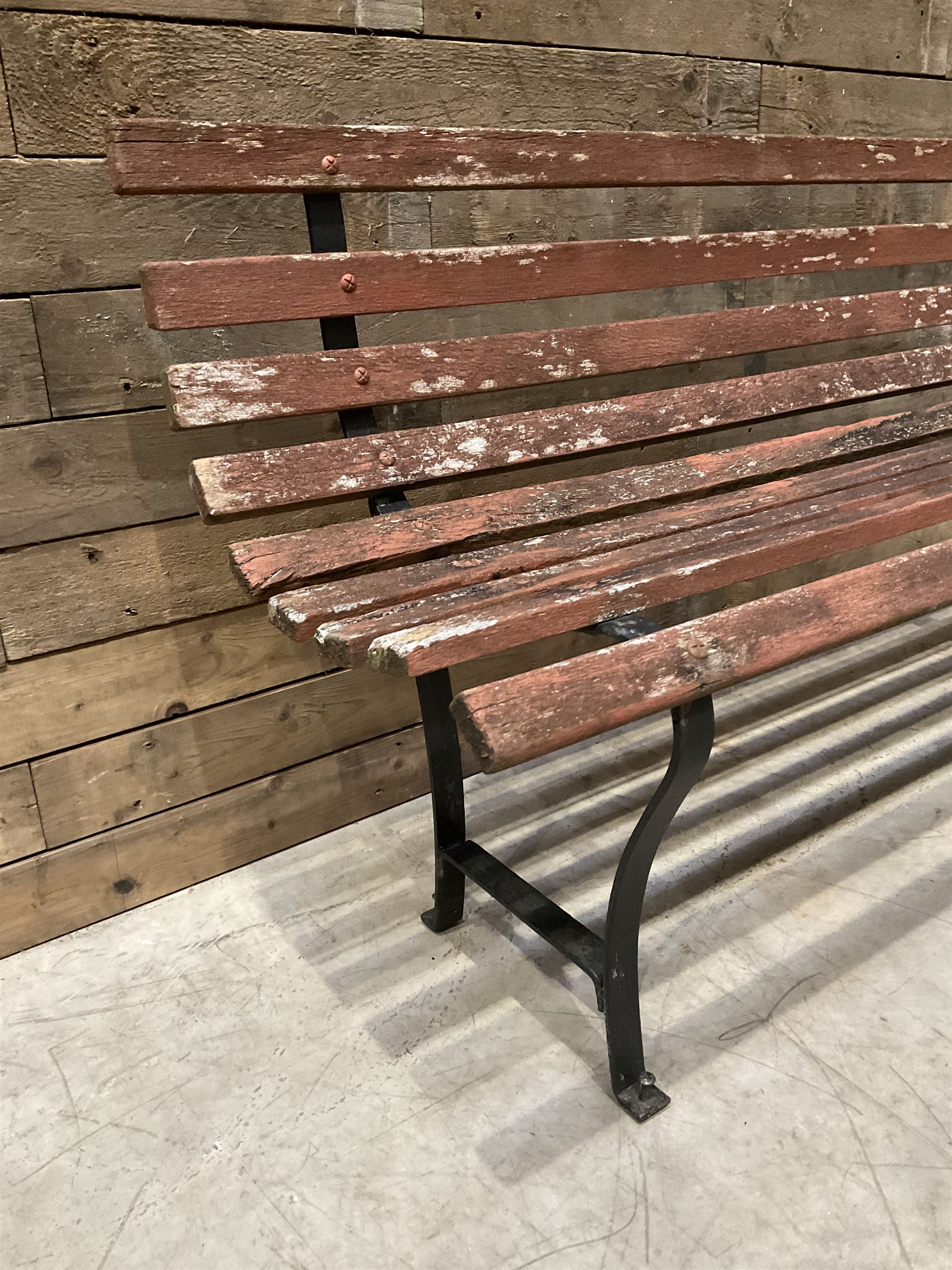 Wrought metal and wood slatted garden bench