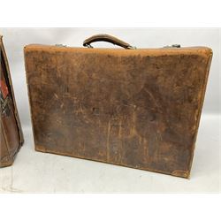 Early 20th century leather suitcase marked to the top 'Major P.M. Newton R.E. Crossways, Bridlington, East Yorkshire' 60 x 40cm; another similar leather suitcase marked W.D. to the lid; three post-WW2 respirators; and three unopened pairs of British Army N.B.C. (Nuclear Biological Chemical) No.1 Mk.III Trousers Protective (8)