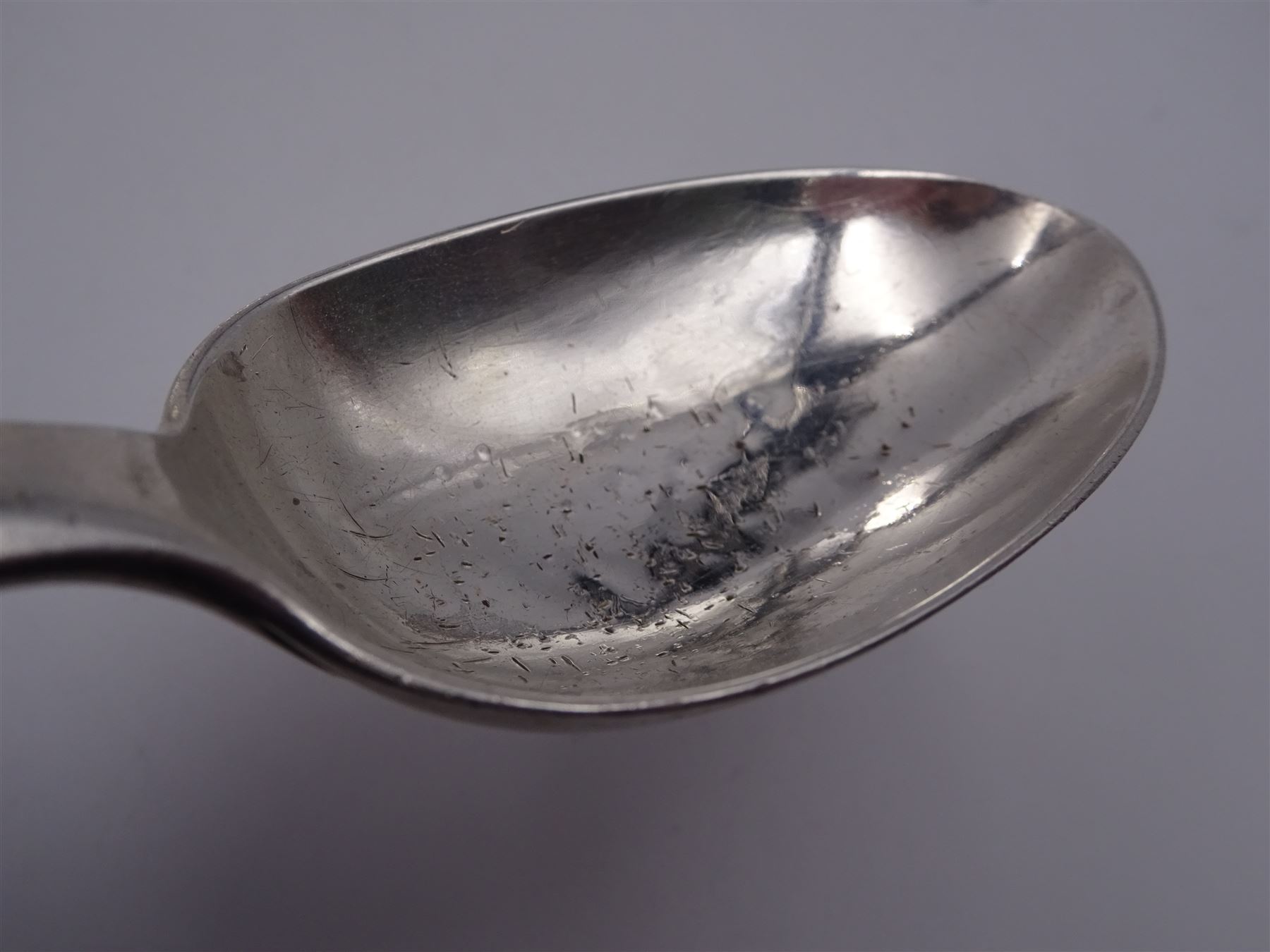 Group of Victorian silver fiddle pattern spoons, comprising pair of sauce ladles and set of six teaspoons, both hallmarked Henry Holland (of Holland, Aldwinckle & Slater), London 1857, set of four table spoons, hallmarked Chawner & Co (George William Adams), London 1857, and set of six dessert spoons, hallmarked Chawner & Co (George William Adams), London 1856, with monogrammed terminals, approximate total silver weight 25.50 ozt (792.6 grams)