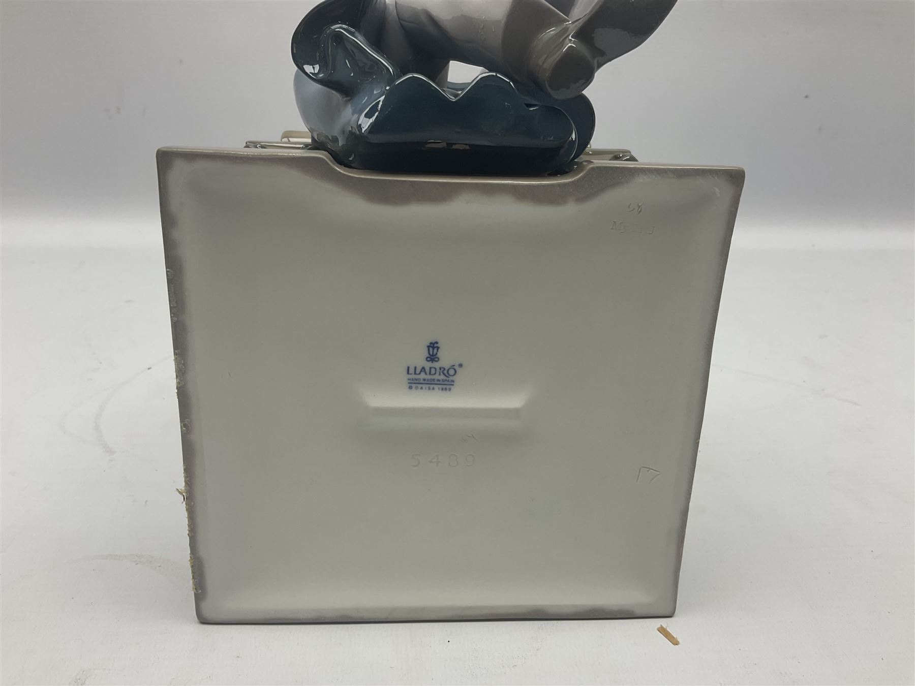 Lladro figure, Justice, modelled as a judge sat in a char, sculpted by Salvador Furió, with original box, no 5489, year issued 1988, year retired 1993, H34cm 