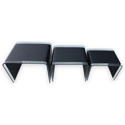 Nest of three contemporary glass occasional tables, black glass centres with  clear glass borders 
