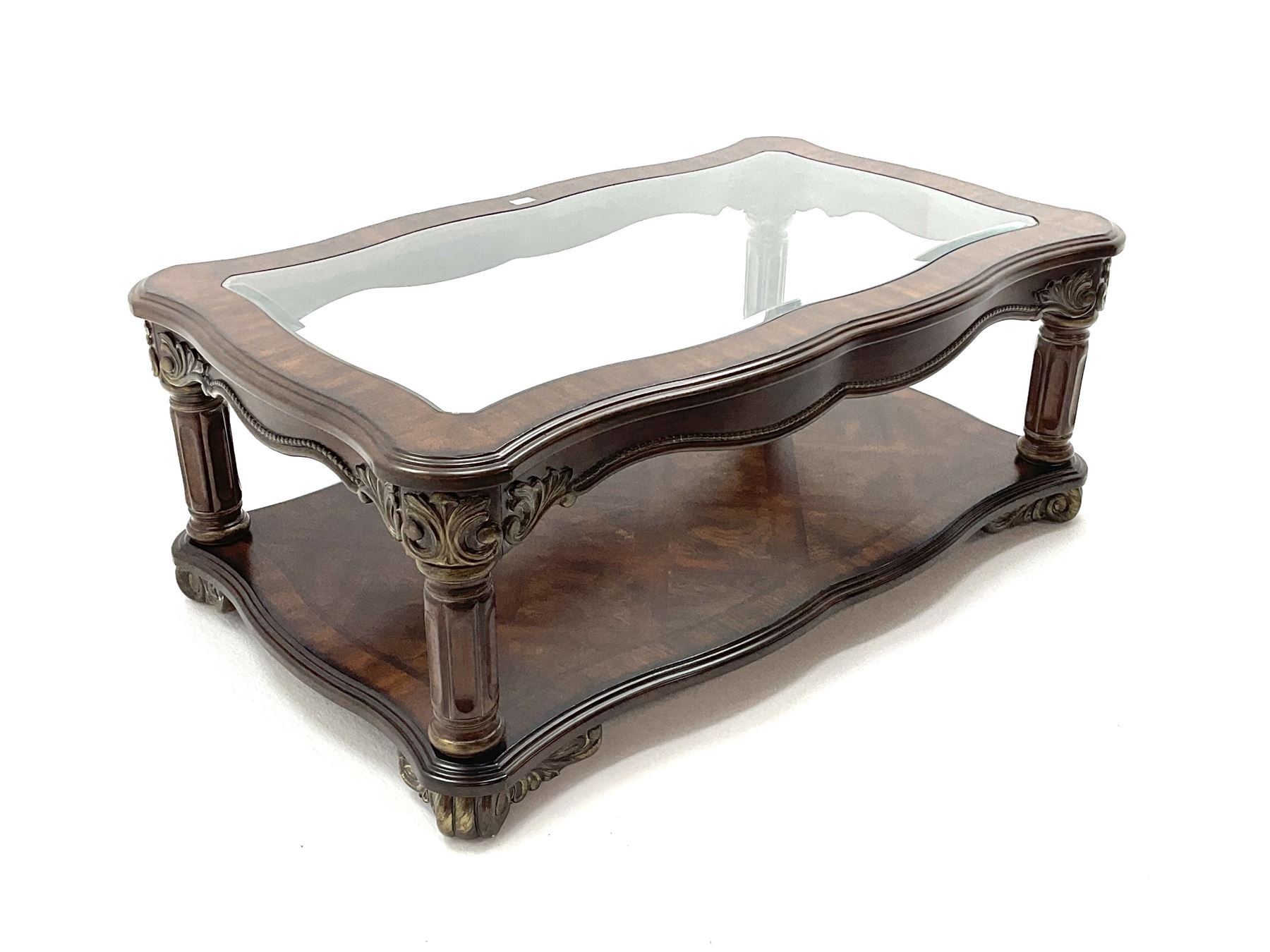 Kevin Charles American walnut rectangular serpentine coffee table , inset glass top, carved column supports joined by undertier 