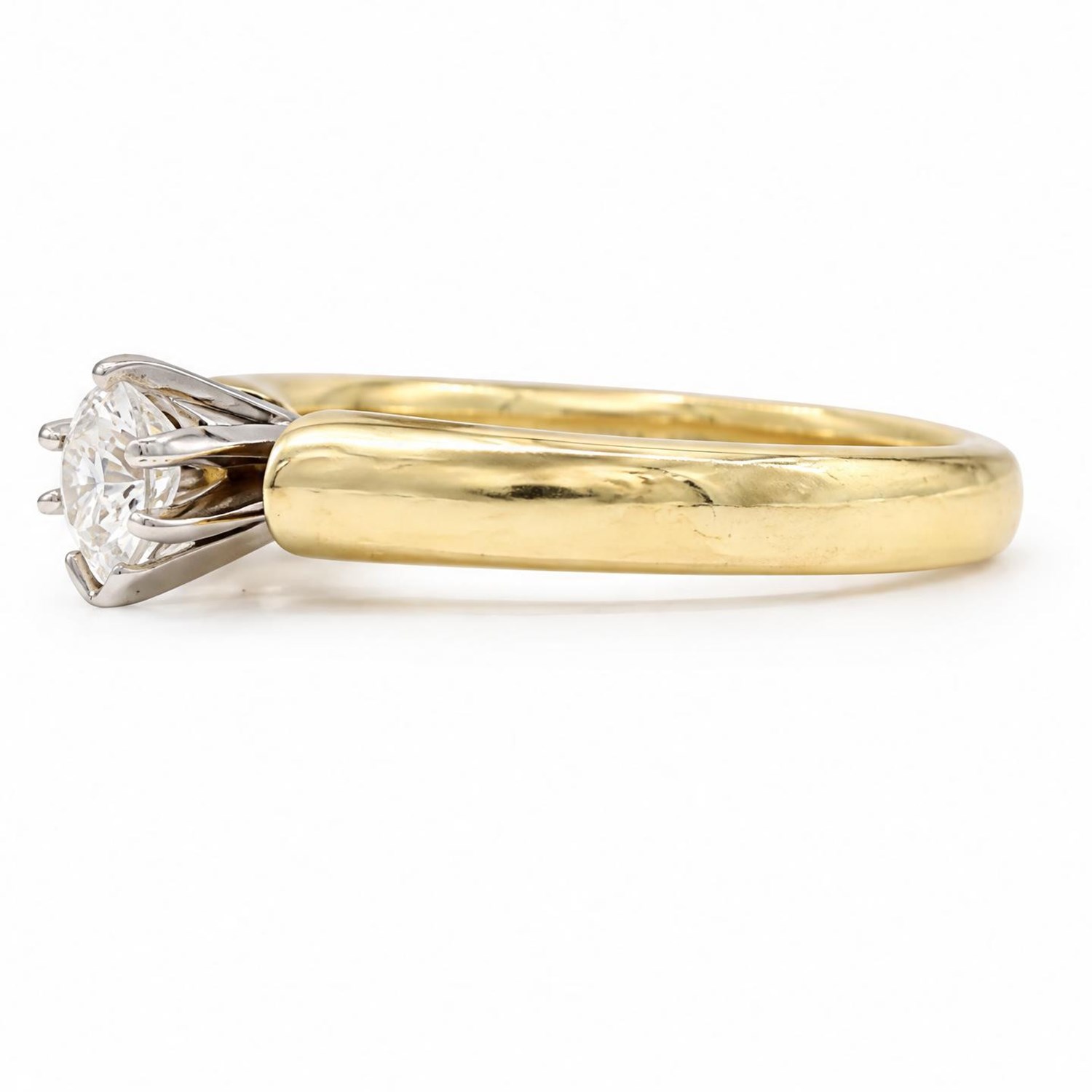 14ct gold diamond ring, claw set with a single pear cut diamond of 0.31 carat, stamped 14K, with IGI report