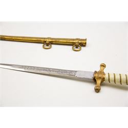 WWII period German Kriegsmarine navel officers dress dagger by Carl Eickhorn, Solingen, with gilded pommel and cross guard with press stud release button, white celluloid grip with wire binding, housed in its original brass scabbard with two hanging rings, the etched double edged blade with Carl Eickhorn, Solingen makers trademark to the base, L39cm