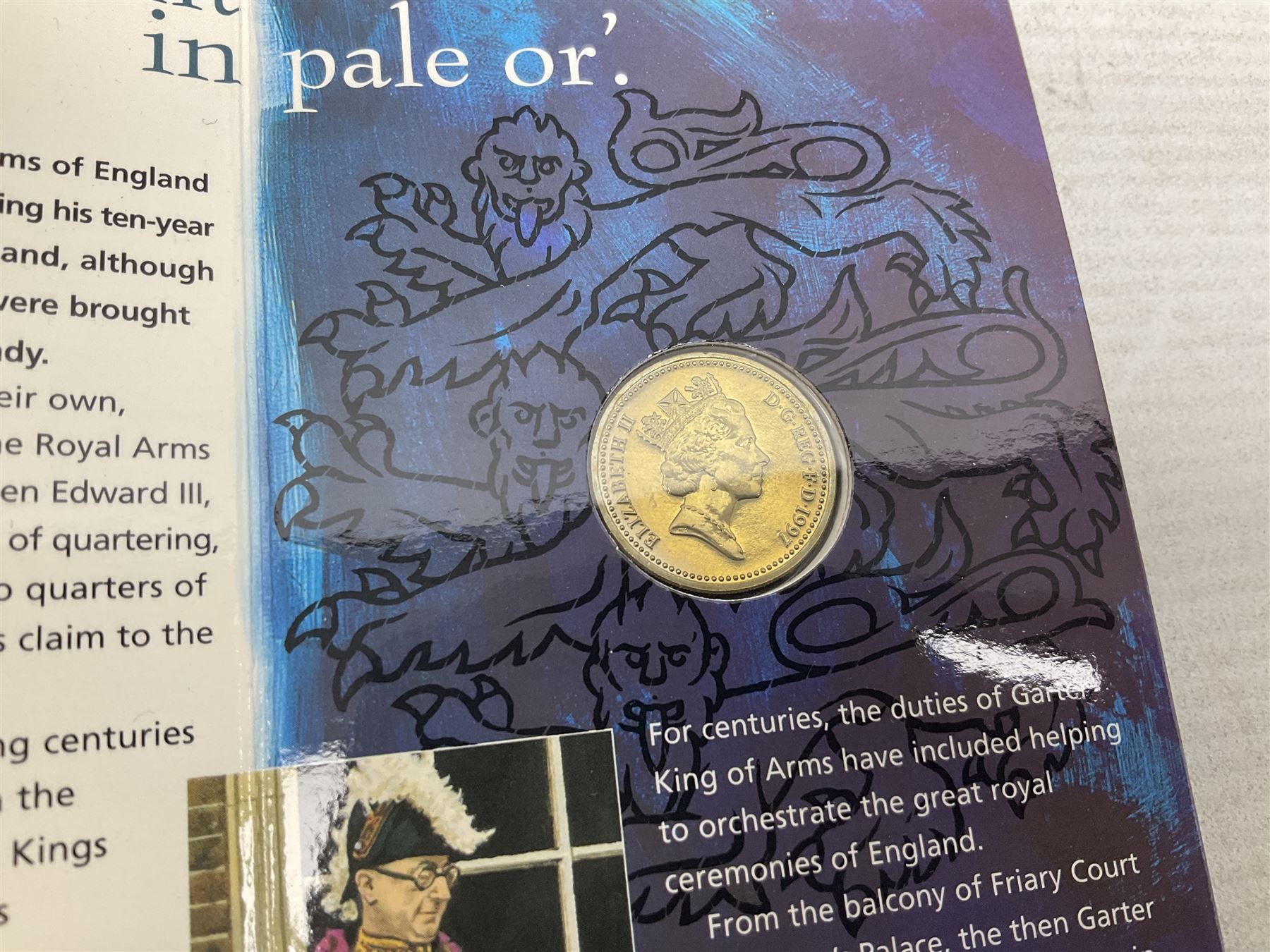 The Royal Mint United Kingdom 1984 brilliant uncirculated coin collection, 1997 and 2001 commemorative crown coins, 1997 old round one pound, all in card folders and four sterling silver medallic first day covers from the 'Great Britons' collection housed in a blue folder