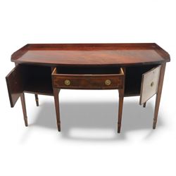  George III mahogany bow-front sideboard, the top with shaped gallery back above one frieze drawers, each outlined with strung inlay, flanked by deep cupboard doors, raised on square tapering legs with spade feet
