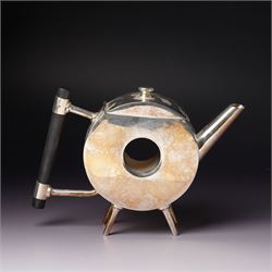 Manner of Christopher Dresser (1834-1904) - two art deco design silver plated teapots, of circular and square form with vacant centre, ebonised handles, each marked and with registration mark, max H18cm (2)