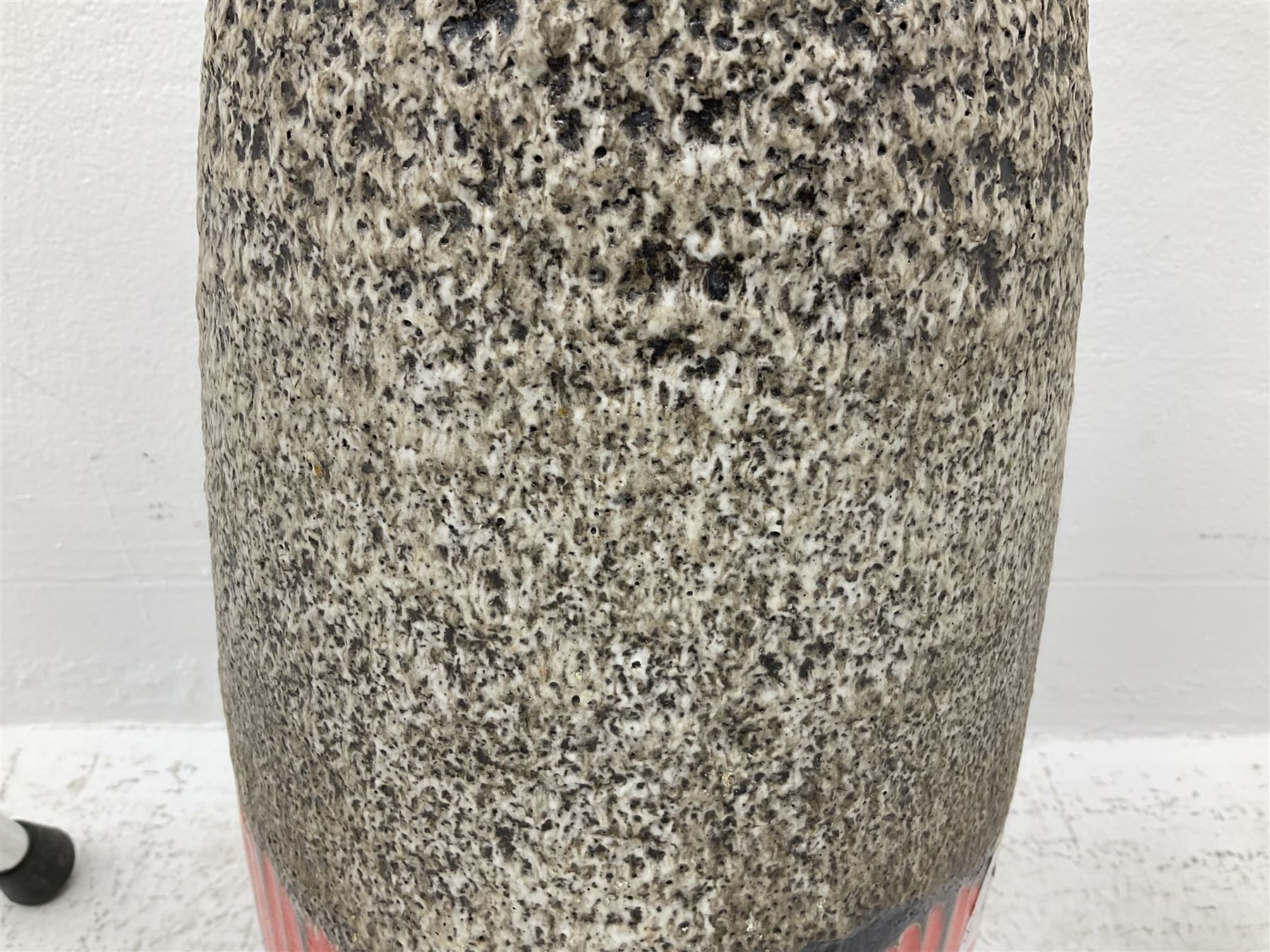 Two smooth polished ram horn handled Shepherd's crooks and a further similar example, together with various shooting sticks, walking sticks and canes, housed in a volcanic lava glaze West German style vase