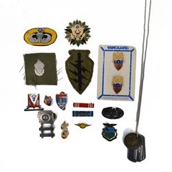 Selection of US army, navy  and air force insignia together with US Army WWII I.D. Tags on...