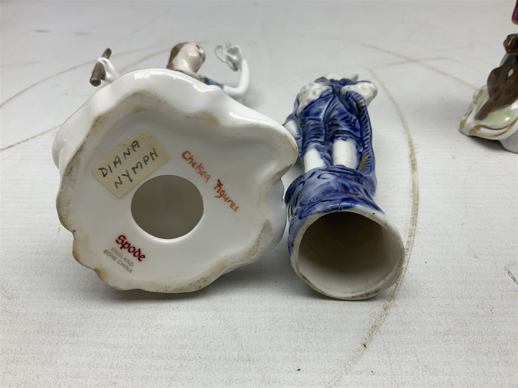 Seven Spode Chelsea figures, comprising no.1, no.2, no.3, no.4, no.6 and two further smaller examples, together with a Dresden figure of a gentleman, no. K10003, and a Delft style figure of a boy, some with boxes, tallest H23cm (9)